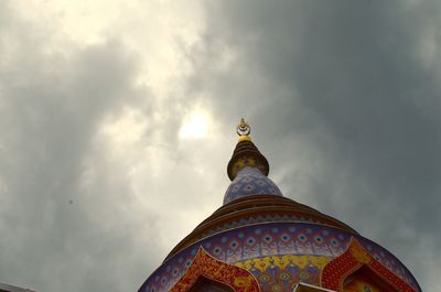 Low angle view of building against cloudy sky