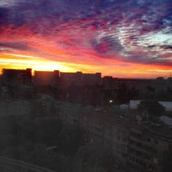 Cityscape against sky during sunset