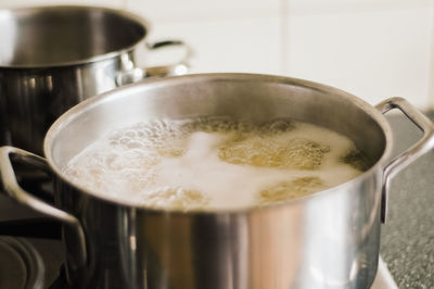 Close-up of food boiling in utensil at kitchen