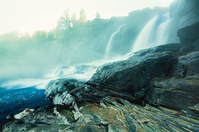 Scenic view of waterfall in forest