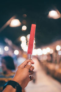 Midsection of person holding ice cream cone