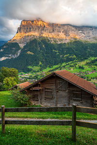 Houses on field against sky