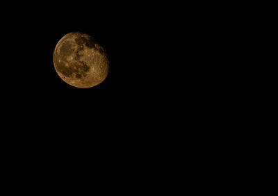 Low angle view of moon against sky at night