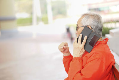 Man using mobile phone outdoors