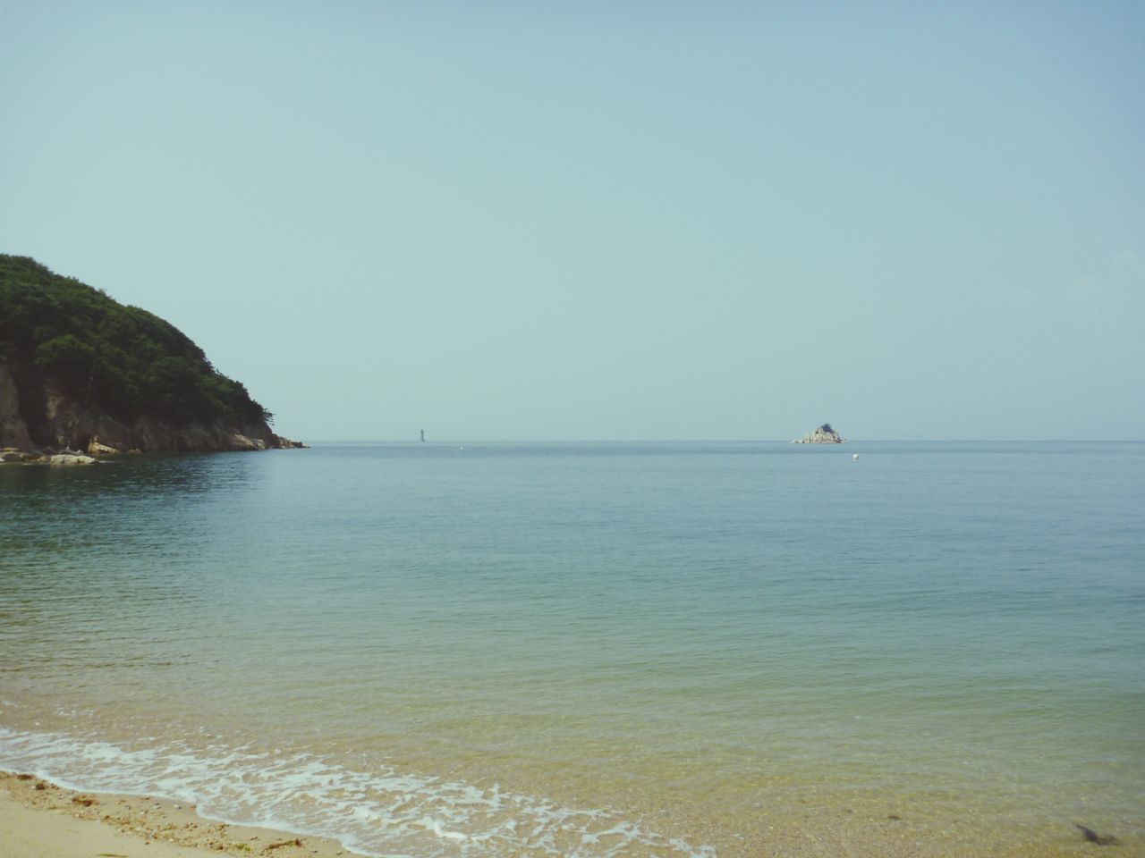 water, sea, clear sky, copy space, horizon over water, tranquil scene, tranquility, scenics, beach, beauty in nature, nature, shore, idyllic, nautical vessel, blue, remote, day, calm, outdoors, sand