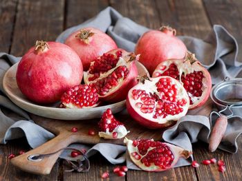 Close-up of pomegranates in plate on table