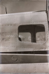 Close-up of old airplane window