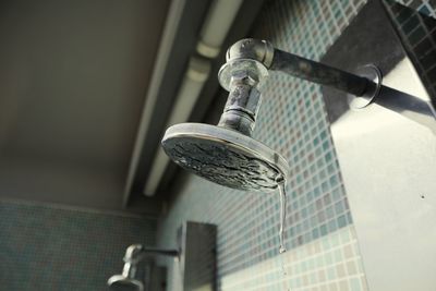 Low angle view of faucet in bathroom