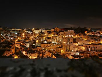 High angle shot of illuminated townscape against sky at night