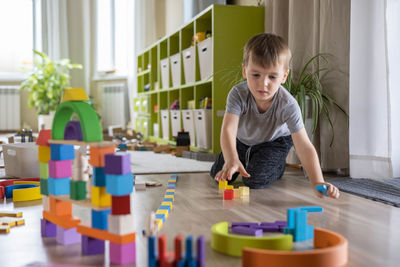 Boy playing with toy blocks