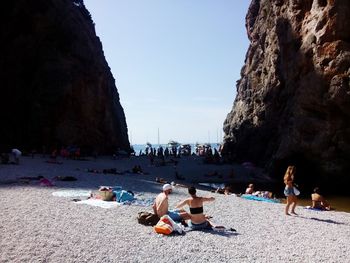 People relaxing on beach