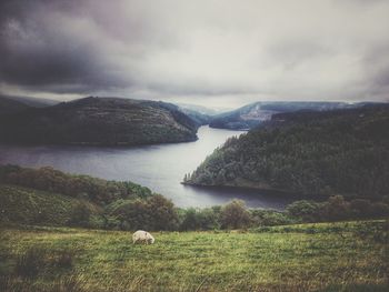 Scenic view of mountain against cloudy sky