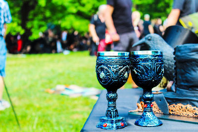 Close-up of drink on table at park