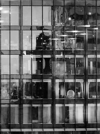 Reflection of building on glass window