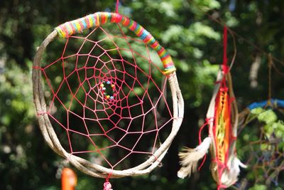 Close-up of dream catcher hanging outdoors