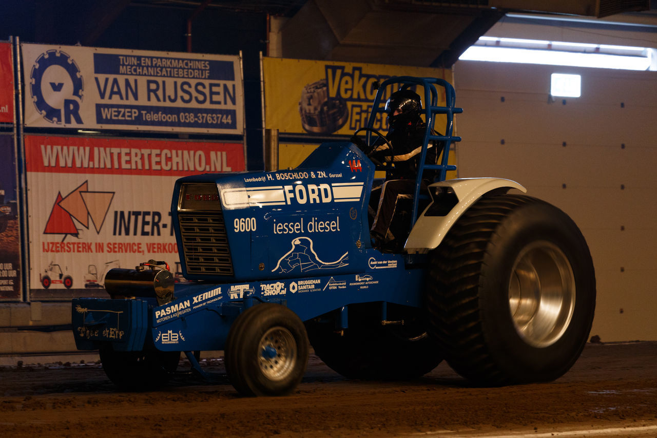 CLOSE-UP OF TIRE WITH TEXT ON THE WALL