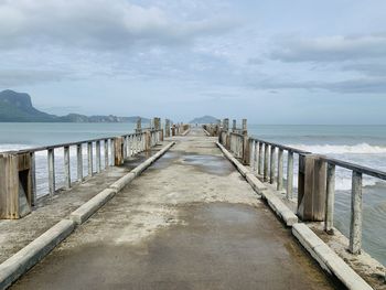 Pier over sea against sky