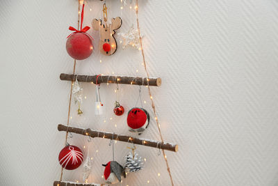 Handmade wooden christmas tree hanging on the wall