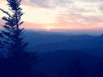 Scenic view of mountains against sky during sunset