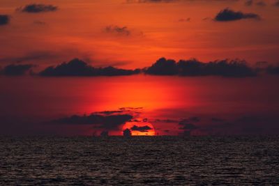 Scenic view of sea against romantic sky at sunset