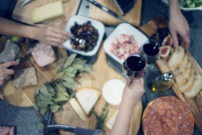 Close-up of cropped hand holding wineglass