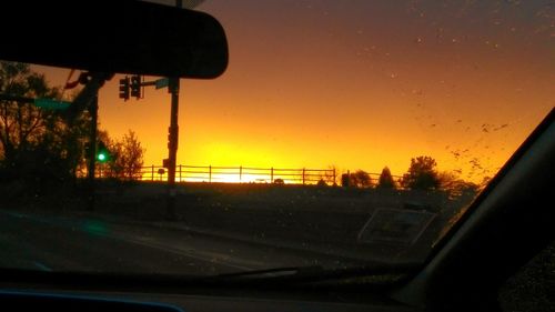 View of road against sky at sunset