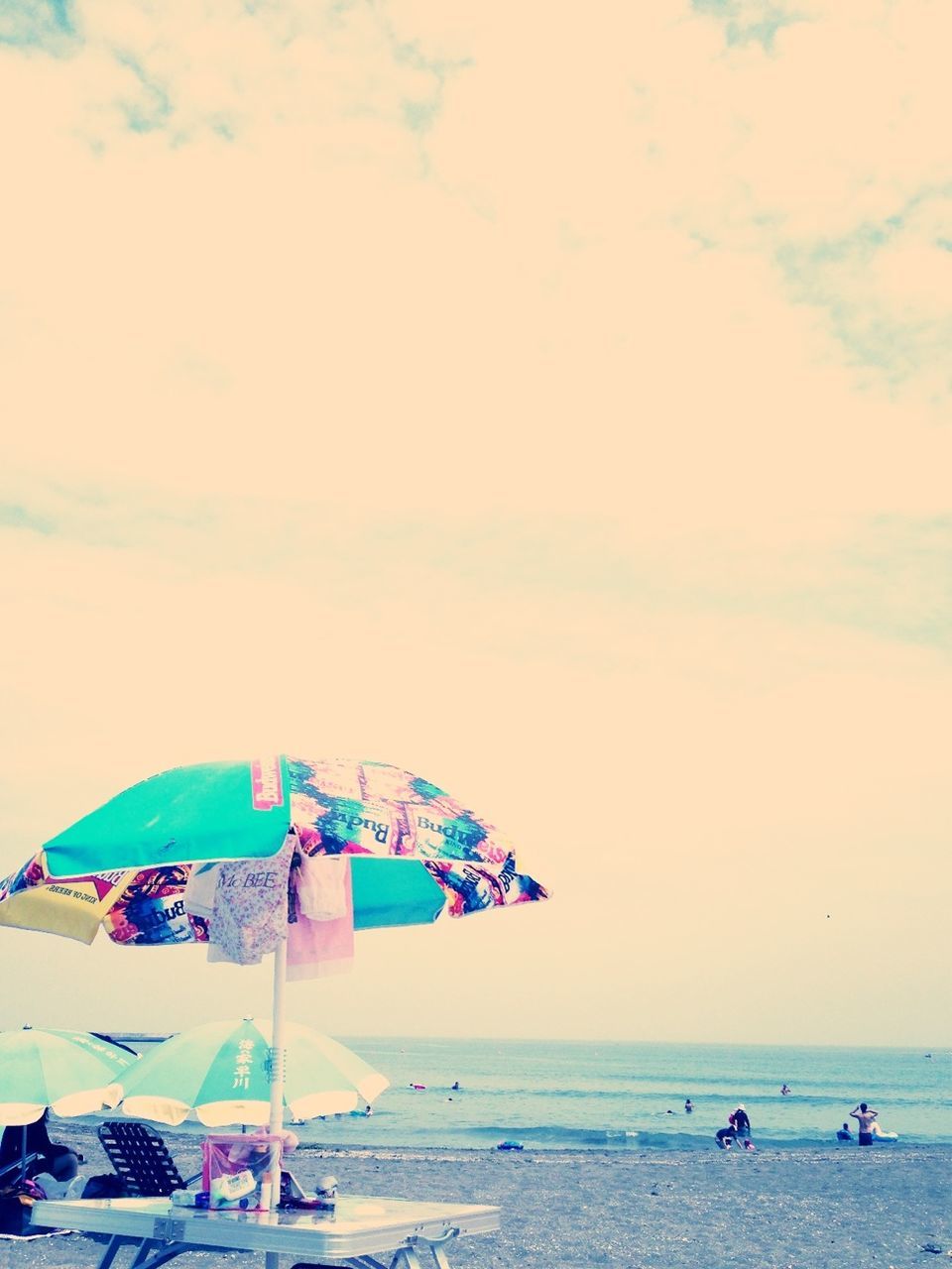 sea, horizon over water, beach, water, sky, shore, vacations, leisure activity, lifestyles, sand, large group of people, men, scenics, cloud - sky, blue, nature, beauty in nature, transportation, enjoyment