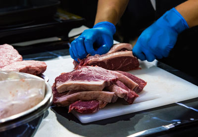 Close-up of person preparing food on table