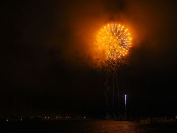 Firework display at night