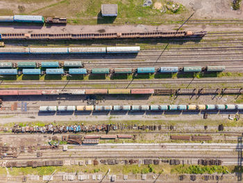 Lots of old railway tracks, trains at the old station, top view.