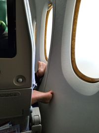 Midsection of man in airplane