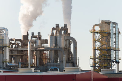 Smoke stack against factory