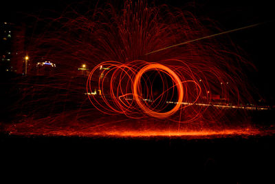 Light painting against sky at night