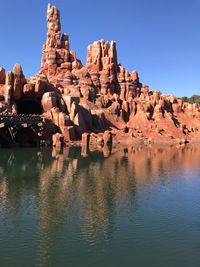 Rock formations against clear blue sky