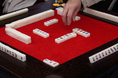 High angle view of person playing with text on table