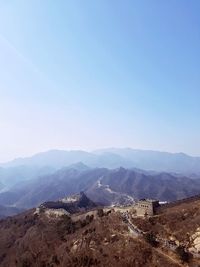 Scenic view of mountains against clear blue sky