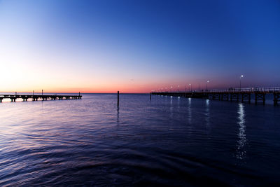 Scenic view of sea against clear sky at night