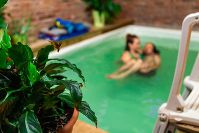 People relaxing in swimming pool