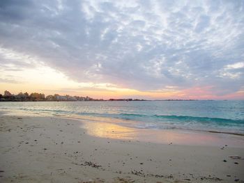 Scenic view of beach against sky during sunset