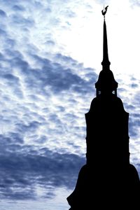 Low angle view of statue against cloudy sky