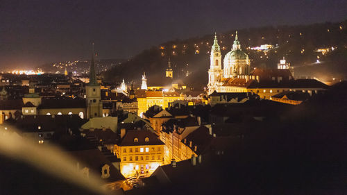 High angle view of illuminated buildings in city at night