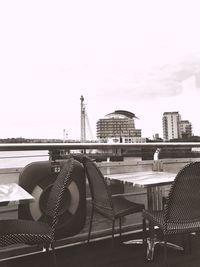 Carousel in amusement park against sky
