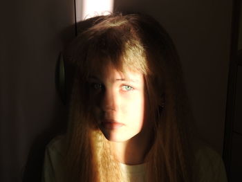 Close-up portrait of girl at home