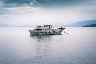 Ship in sea against sky