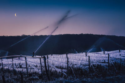 Scenic view of field against sky at dusk