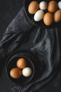 High angle view of eggs in bowl on table