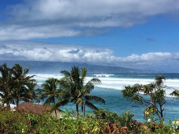Scenic view of sea against cloudy sky