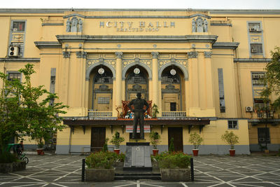 People outside historic building