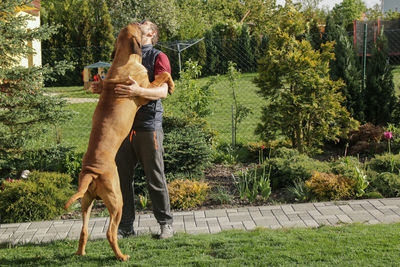Man with big dog outdoors