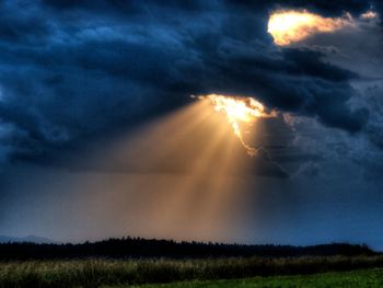 Scenic view of field against sky during sunset